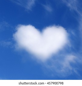 Blue sky with heart shaped cloud - Shutterstock ID 457900798