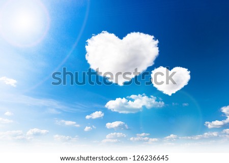 blue sky with hearts shape clouds. Beauty natural background