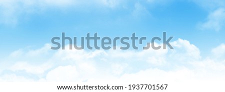 Blue sky with light clouds. Wide summer sky backdrop
