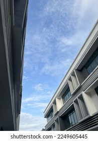 Blue sky with little cloud in between building background