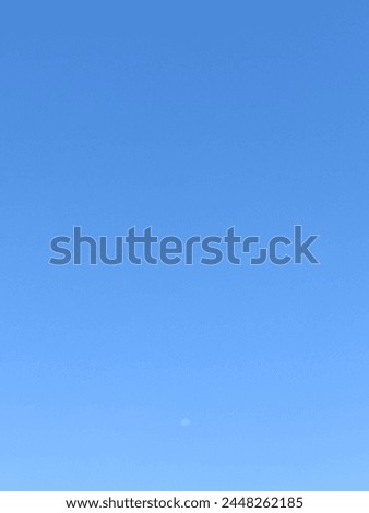blue sky and moon in the afternoon