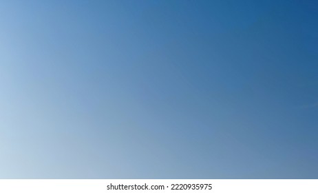 Blue sky with occasional clouds. Autumn day high in the sky translucent white cirrus and cumulus clouds. They are blurry translucent and have different shapes and sizes. - Shutterstock ID 2220935975