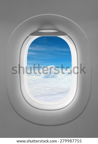 Blue sky outside window plane, gray airplane window, plain aircraft window soft light and white flat cloud.