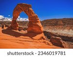 Blue sky over the iconic Delicate Arch, a geological wonder of time and erosion.  Located in Arches National Park near Moab in central Utah, United States.