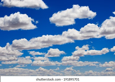 Blue Sky And Puffy Clouds