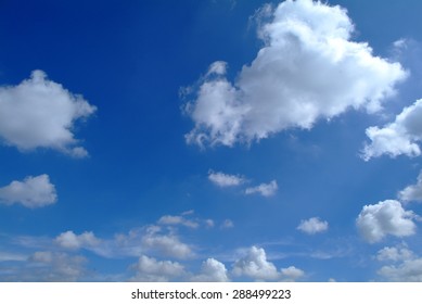 Blue Sky And Puffy Clouds