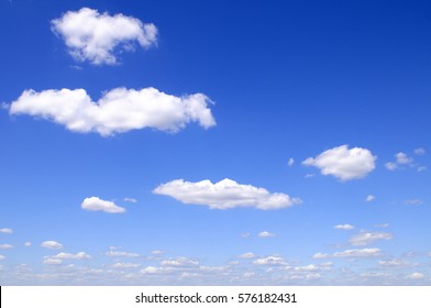 Blue Sky And Puffy Clouds