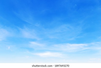 Blue sky with puffy clouds background - Shutterstock ID 1897693270