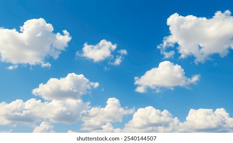 Blue sky with scattered white cumulus clouds. 
