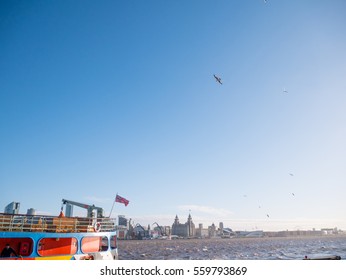 Blue Sky With The Small Birds On The Mersey River