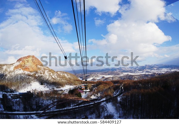 blue\
sky and snow Mountain in Japan form cable car sky network on\
daytime.\
Blue sky and snow mountain background.\
\

