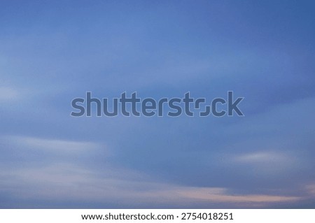 Blue sky with soft clouds and subtle twilight gradient near the horizon, natural sky background for wallpaper or nature concept