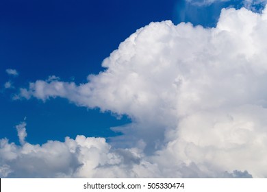 Blue Sky With Some White Puffy Clouds