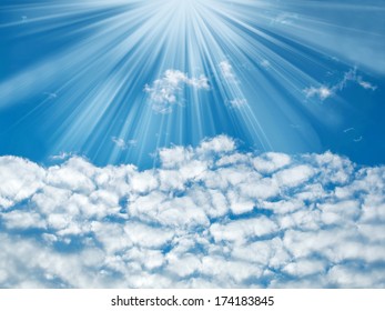 Blue sky with sun rays and clouds, nature background