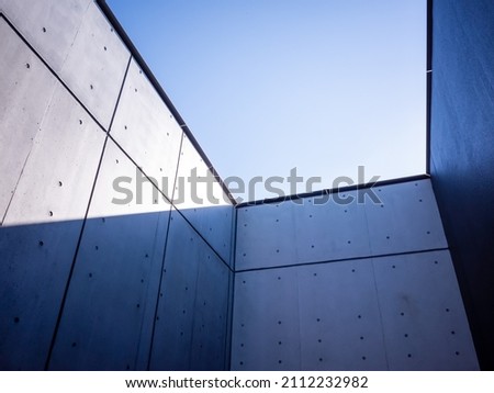 blue sky surrounded by inorganic concrete walls in japan