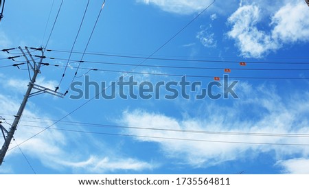 Blue sky and telephone pole