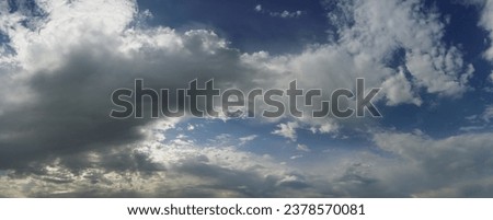 blue sky with thick white clouds