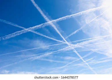 Blue sky with vapor trail, above Great Britain.