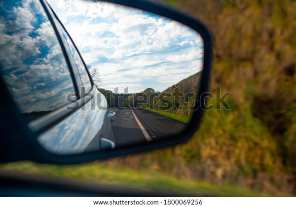 \
Blue sky view from\
the car\'s rear view