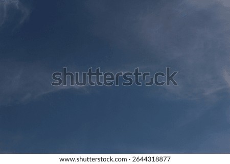 blue sky with whisp clouds 