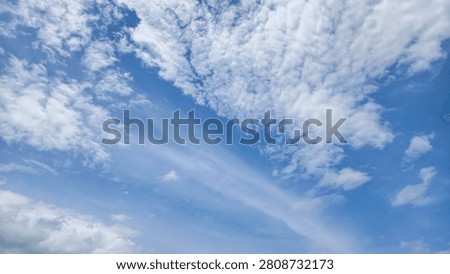 a blue sky with white clouds