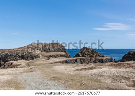Blue sky, white clouds, calm sea. There is no Puffin's Puffin Viewing Site yet, the scenery of the bay. -Elliston, Newfoundland and Labrador, Canada. 