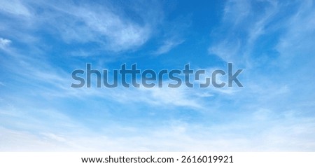 blue sky with white clouds. The sky is clear and bright
