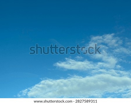 Blue Sky With White Clouds Creating a Bright Natural Background and Peaceful Atmospheric Scene