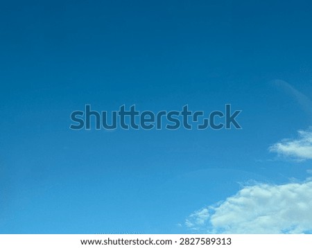 Blue Sky With White Clouds Creating a Bright Natural Background and Peaceful Atmospheric Scene