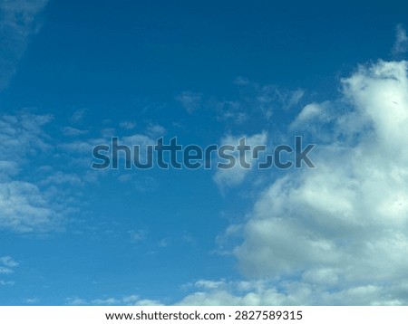 Blue Sky With White Clouds Creating a Bright Natural Background and Peaceful Atmospheric Scene