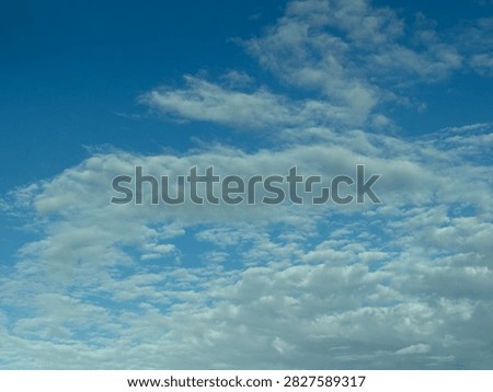 Blue Sky With White Clouds Creating a Bright Natural Background and Peaceful Atmospheric Scene