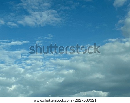Blue Sky With White Clouds Creating a Bright Natural Background and Peaceful Atmospheric Scene