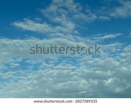 Blue Sky With White Clouds Creating a Bright Natural Background and Peaceful Atmospheric Scene