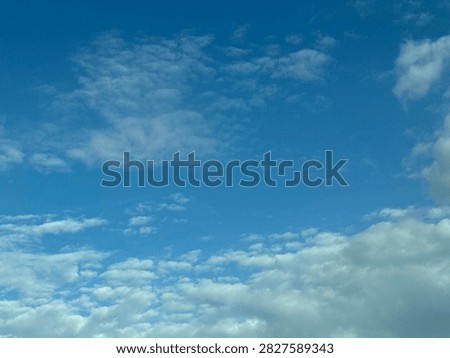 Blue Sky With White Clouds Creating a Bright Natural Background and Peaceful Atmospheric Scene