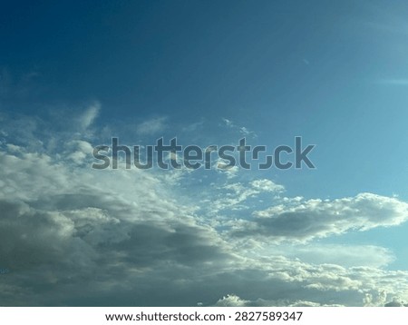 Blue Sky With White Clouds Creating a Bright Natural Background and Peaceful Atmospheric Scene