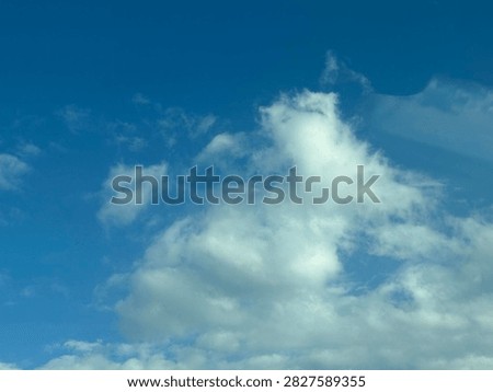 Blue Sky With White Clouds Creating a Bright Natural Background and Peaceful Atmospheric Scene