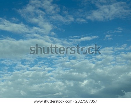 Blue Sky With White Clouds Creating a Bright Natural Background and Peaceful Atmospheric Scene