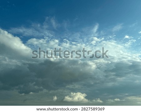 Blue Sky With White Clouds Creating a Bright Natural Background and Peaceful Atmospheric Scene
