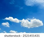 Blue sky and white clouds. Daytime sky. Sky background
tacked stone brick wall. Stone cladding wall made of striped stacked slabs of natural grey rocks. Panels for exterior. pattern of decorative