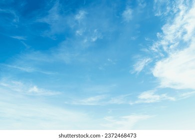 Blue sky with white clouds float in the sky on clear day with warm sunshine combined with cool breeze blowing - Powered by Shutterstock