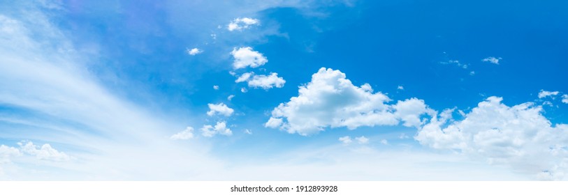 Blue sky and white clouds floated in the sky on a clear day with warm sunshine combined with cool breeze blowing against the body resulting in a miraculous refreshing like paradise. - Shutterstock ID 1912893928