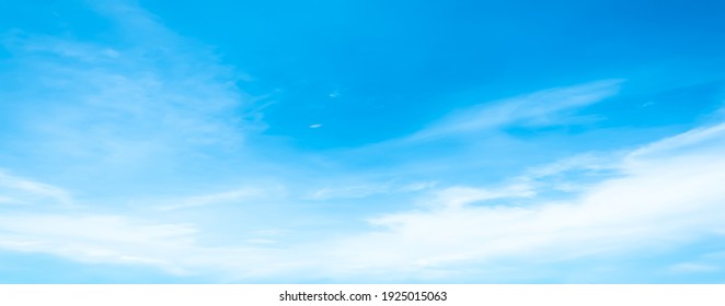 Blue sky and white clouds floated in the sky on a clear day with warm sunshine combined with cool breeze blowing against the body resulting in a miraculous refreshing like paradise. - Shutterstock ID 1925015063