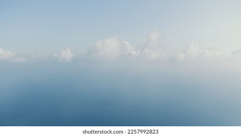 Blue sky with white clouds over calm summer panorama of the sea. Drone aerial view. Abstract aerial nature summer ocean sunset sea and sky background. Horizon. No people. Holiday and vacation concept - Shutterstock ID 2257992823