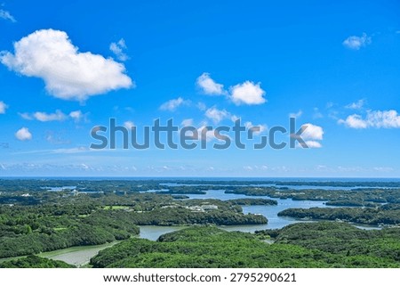 Blue Sky with White Clouds over Ago Bay Coastal Landscape