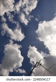 Blue Sky and White Clouds in Vertical View - Shutterstock ID 2248504117