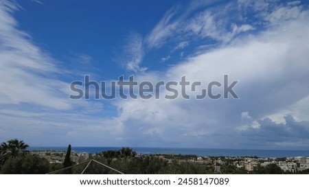 Blue sky with white clouds, view from the roof of connery in Paphos, 