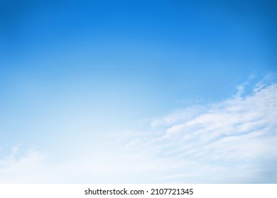 Blue sky with white fluffy cirrus clouds soft focus. Heavenly clouds background summer. Concept of freedom, relaxation, ecology. Copy space. Empty space for your message.