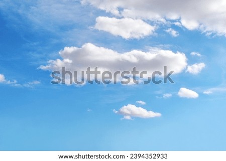 Blue sky with white fluffy cloud. Cumulus clouds background. Cloudscape morning sky. The concepts of freedom of live, never give up and positive though energy.