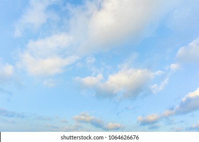 Blue Sky And White Puffy Clouds