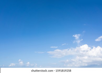 Blue Sky And White Puffy Clouds